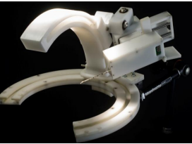 On the Design of a Biopsy Needle-Holding Robot for a Novel Breast Biopsy Robotic Navigation System