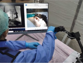 Sensorless based Haptic Feedback Integration in Robot-Assisted Pedicle Screw Insertion for Lumbar Spine Surgery: A Preliminary Cadaveric Study